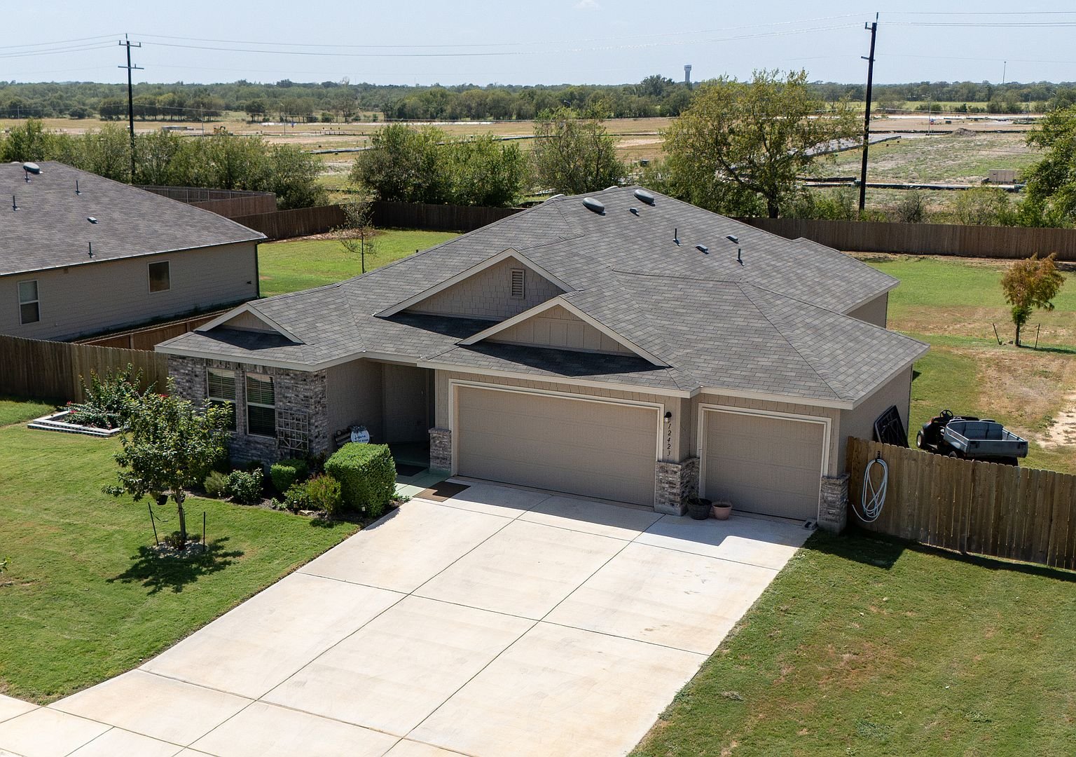 Aerial view of the home and half-acre lot