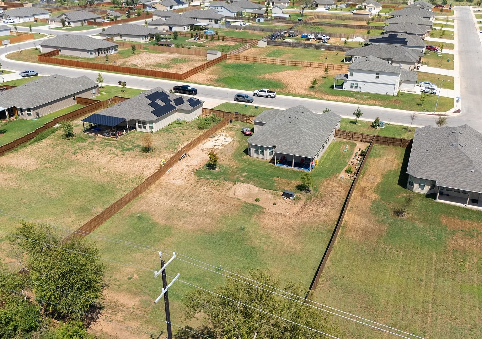 Aerial view of the neighborhood and open land